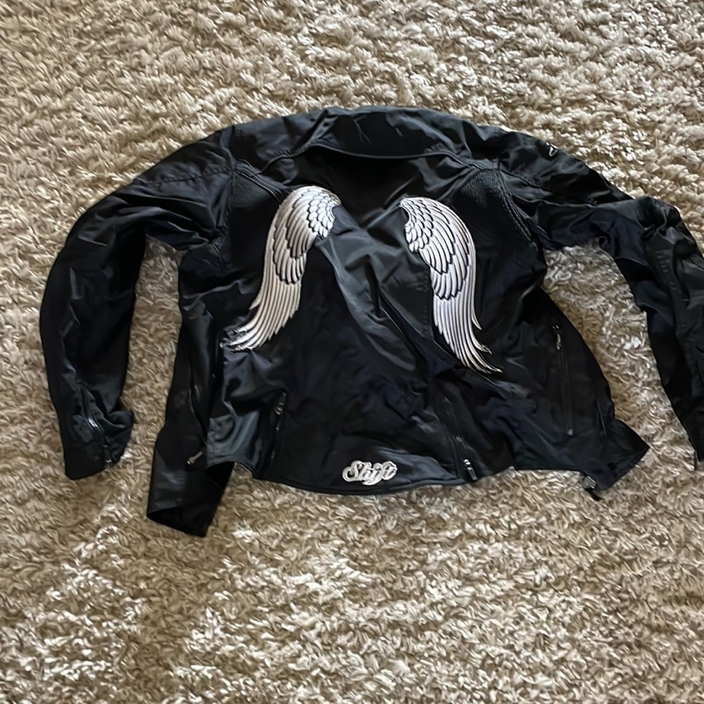 Shift women’s motorcycle jacket, size large back padding, elbow pads, like new